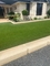 屋外の緑の擬似草の床は庭のための総合的な人工的な泥炭にカーペットを敷く サプライヤー